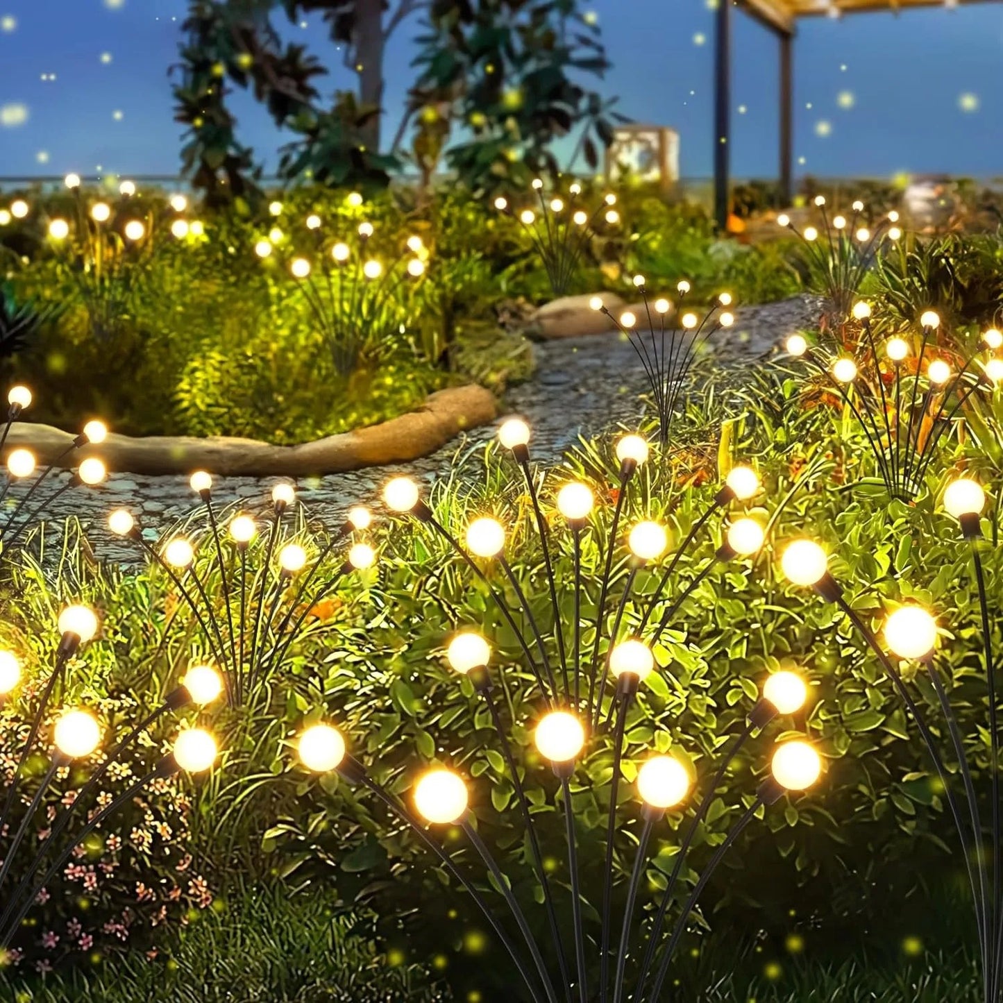 Firefly lights lining a garden path after sunset