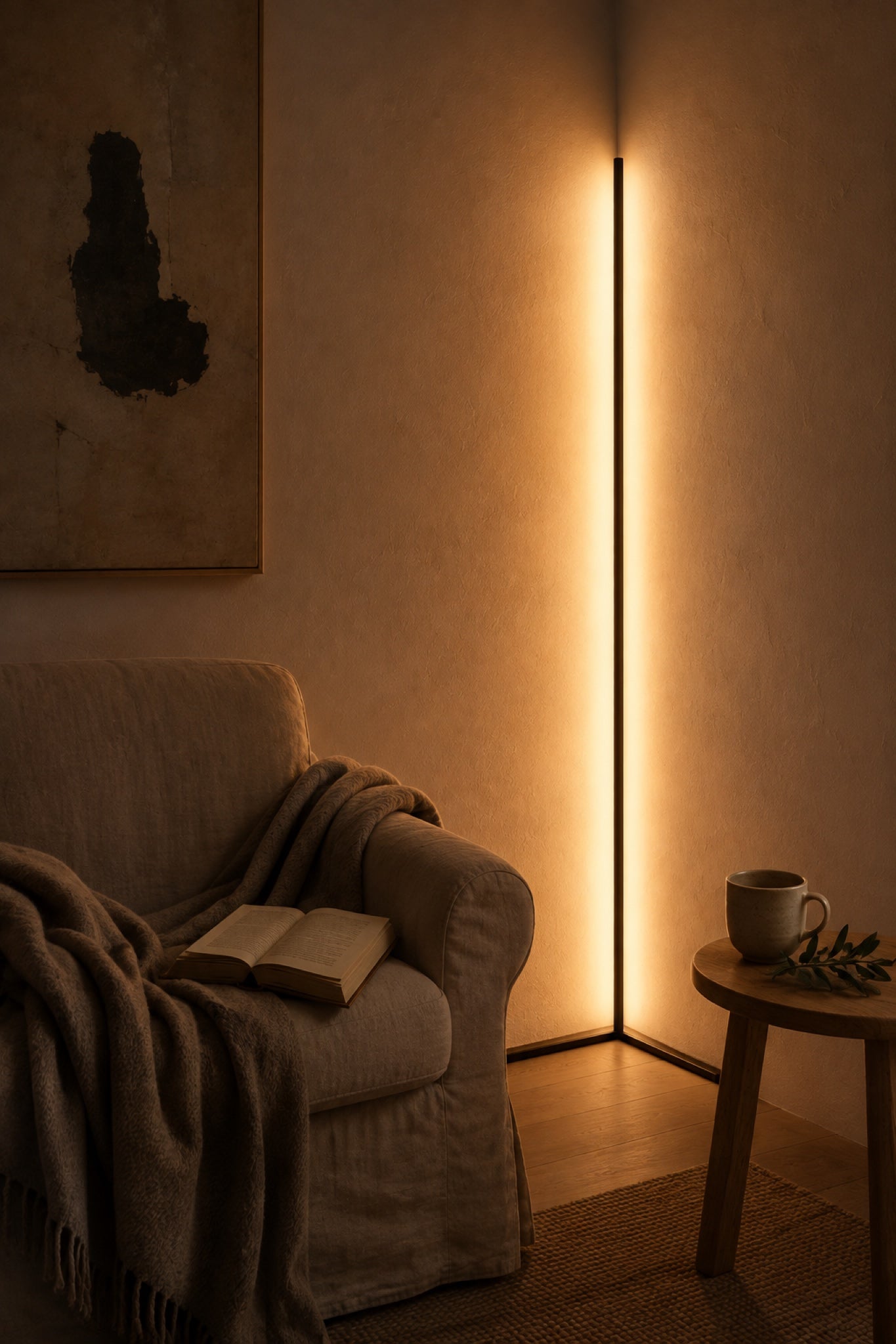 Golden Hour corner lamp lighting a reading corner with linen armchair and wool throw