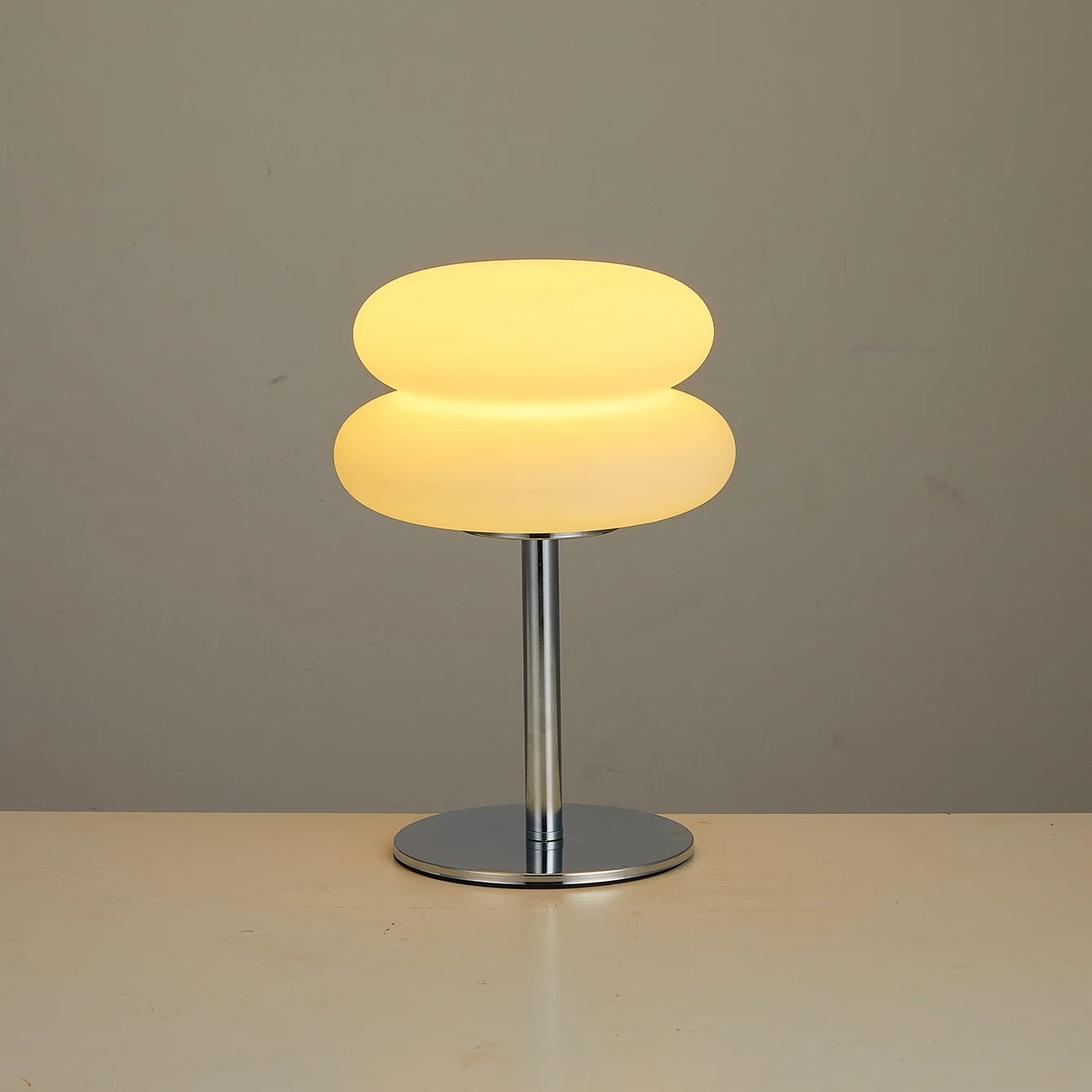The Mushroom lamp lit in warm amber